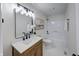 Bathroom features a single sink vanity and a shower-tub combination with white tiling at 8178 Foxchase Cir, Indianapolis, IN 46256