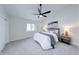Comfortable bedroom featuring neutral paint, carpet, ceiling fan, and natural light from the window at 8178 Foxchase Cir, Indianapolis, IN 46256