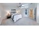 Bright bedroom boasts a vaulted ceiling with a skylight and a stylish adjacent bathroom at 8178 Foxchase Cir, Indianapolis, IN 46256
