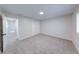 Bright bedroom with neutral carpet, white walls, closet, and window with natural light at 8178 Foxchase Cir, Indianapolis, IN 46256