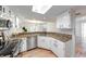 Well-equipped kitchen with stainless appliances, granite countertops, wood floors, and white cabinets at 8178 Foxchase Cir, Indianapolis, IN 46256