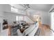A open concept living room featuring hardwood floors, a fireplace, stairs to a second floor and an entryway at 8178 Foxchase Cir, Indianapolis, IN 46256
