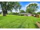 Expansive backyard featuring well-maintained lawn, mature trees, and a serene setting at 8760 Big Bend Rd, Martinsville, IN 46151