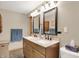 Modern bathroom featuring double sinks with granite countertop and modern fixtures at 8760 Big Bend Rd, Martinsville, IN 46151