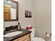 Neutral bathroom featuring a granite countertop and wood-framed mirror at 8760 Big Bend Rd, Martinsville, IN 46151