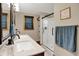 Modern bathroom featuring double sinks, granite countertop, and glass enclosed shower at 8760 Big Bend Rd, Martinsville, IN 46151
