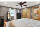 Cozy bedroom featuring a ceiling fan, wood closet doors, and ensuite bathroom at 8760 Big Bend Rd, Martinsville, IN 46151