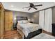 Comfortable bedroom features hardwood floors, a ceiling fan, and natural light from a window at 8760 Big Bend Rd, Martinsville, IN 46151