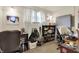Bedroom with a fair amount of clutter, including a desk, storage, and a window with white curtains at 8760 Big Bend Rd, Martinsville, IN 46151