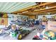 Spacious garage with ample storage, featuring tools, lawn equipment, and a boat at 8760 Big Bend Rd, Martinsville, IN 46151
