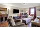 Cozy living room with hardwood floors, comfortable seating arrangements, and a warm, inviting atmosphere at 8760 Big Bend Rd, Martinsville, IN 46151