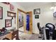 Untidy office space with Indiana Hoosier decor and view into the kitchen at 8760 Big Bend Rd, Martinsville, IN 46151