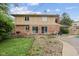View of the backyard featuring a brick and siding house, a patio and grassy area at 904 Dreamy St, Greenwood, IN 46142