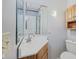 Cozy bathroom with a corner sink, mirrored wall, and wood accents for a functional and inviting space at 904 Dreamy St, Greenwood, IN 46142