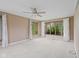 Bright bedroom with plush carpet, a ceiling fan, and multiple windows offering natural light at 904 Dreamy St, Greenwood, IN 46142