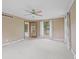 Spacious bedroom featuring soft carpet, a ceiling fan, and a doorway leading to another room at 904 Dreamy St, Greenwood, IN 46142