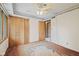Bedroom with neutral wallpaper, natural wood trim, and a closet for storage at 904 Dreamy St, Greenwood, IN 46142