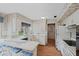 Bright eat-in kitchen with white cabinets, a breakfast bar, and a view of the backyard at 904 Dreamy St, Greenwood, IN 46142