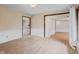Empty living room featuring light colored walls and floors that lead to other rooms at 904 Dreamy St, Greenwood, IN 46142