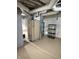 Unfinished basement with exposed pipes and painted concrete flooring offers potential for customization at 9168 S State Road 9, Flat Rock, IN 47234