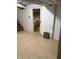 Basement area with painted brick walls, door and painted flooring at 9168 S State Road 9, Flat Rock, IN 47234