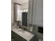 Bathroom vanity with a white countertop, updated lighting, and ample storage with stylish white cabinetry at 9168 S State Road 9, Flat Rock, IN 47234