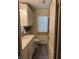Charming bathroom featuring a white vanity, modern fixtures, and a decorative brick accent wall at 9168 S State Road 9, Flat Rock, IN 47234