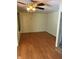 Bright dining area with warm wooden floors and a ceiling fan at 9168 S State Road 9, Flat Rock, IN 47234