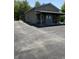 Charming building with a covered porch, parking lot, and a beautiful blue door at 9168 S State Road 9, Flat Rock, IN 47234