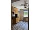 Kitchen featuring wood cabinets, stainless steel microwave, and wood flooring at 9168 S State Road 9, Flat Rock, IN 47234