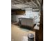 Well-lit basement laundry room with front load washer and dryer units and window at 9168 S State Road 9, Flat Rock, IN 47234