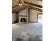 Spacious living room with stone fireplace and wood burning stove at 9168 S State Road 9, Flat Rock, IN 47234