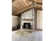 Living room featuring a stone fireplace with a wood burning stove at 9168 S State Road 9, Flat Rock, IN 47234