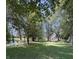 Scenic view of the property's grassy and wooded area with a small pond at 9168 S State Road 9, Flat Rock, IN 47234