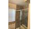 Tiled shower with glass enclosure, complemented by a window bringing in natural light at 9168 S State Road 9, Flat Rock, IN 47234