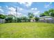 Expansive backyard featuring a shed, wooden fence, and lush green lawn at 917 W 8Th St, Anderson, IN 46016