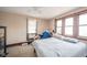 A bedroom awaits new decor with generous natural light from multiple windows at 917 W 8Th St, Anderson, IN 46016