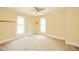 A cozy bedroom provides a blank canvas with ample natural light from two windows at 917 W 8Th St, Anderson, IN 46016