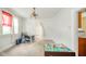 Bright dining area with table setting and adjacent play area at 917 W 8Th St, Anderson, IN 46016
