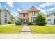 Charming two-story home with a covered front porch and well-maintained lawn at 917 W 8Th St, Anderson, IN 46016