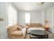 Cozy living room featuring comfortable sofas and natural light from the windows at 917 W 8Th St, Anderson, IN 46016