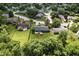 An aerial view showcasing a home with a fenced backyard and lush trees, creating a private outdoor space at 9265 Brunson Run, Indianapolis, IN 46256