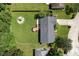 Overhead shot of a home featuring a wooden deck, fenced in yard, and mature trees surrounding the property at 9265 Brunson Run, Indianapolis, IN 46256