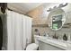 Updated bathroom with modern finishes including decorative tile and new vanity at 9265 Brunson Run, Indianapolis, IN 46256