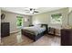Light filled bedroom featuring laminate floors, neutral paint, and lots of natural light at 9265 Brunson Run, Indianapolis, IN 46256