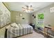 Relaxing bedroom with stylish decor, neutral walls, and wood-look laminate flooring at 9265 Brunson Run, Indianapolis, IN 46256