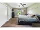 This spacious bedroom boasts hardwood floors, a ceiling fan, and warm, cozy vibes at 9265 Brunson Run, Indianapolis, IN 46256
