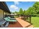 Relaxing deck featuring two lounge chairs; a perfect space to enjoy the tranquil backyard at 9265 Brunson Run, Indianapolis, IN 46256