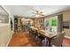 Cozy dining room featuring a wooden table, ceiling fan, and access to outdoor patio at 9265 Brunson Run, Indianapolis, IN 46256