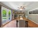 This dining room has a stone fireplace, wine rack, and access to the backyard at 9265 Brunson Run, Indianapolis, IN 46256